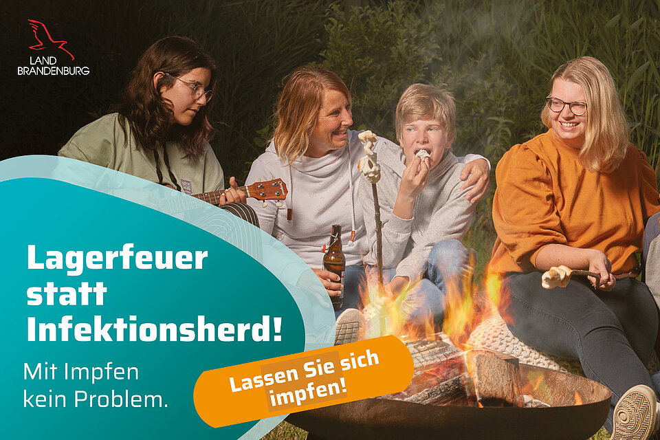 Werbebild Impfkampagne Freundesgruppe am Lagerfeuer